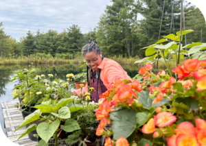 Dr. Ashley B. Gripper surrounded by plants