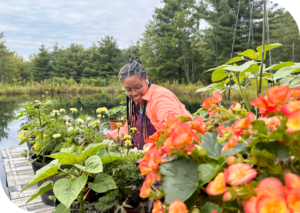 Dr. Ashley B. Gripper surrounded by plants